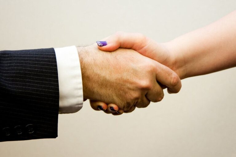 Business partnership handshake agreement