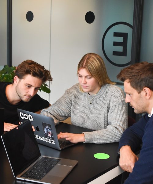man in gray dress shirt sitting beside woman in green crew neck t-shirt